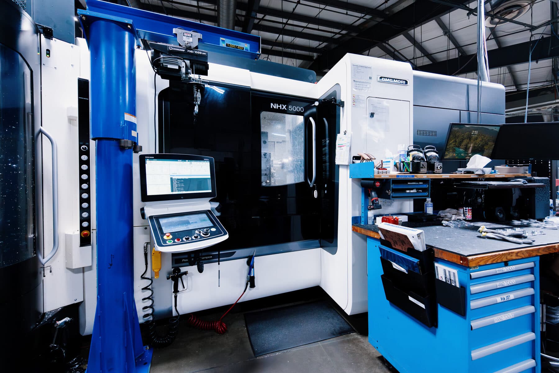 A DMG Mori NHX 5000 horizontal machining centre with its control screen