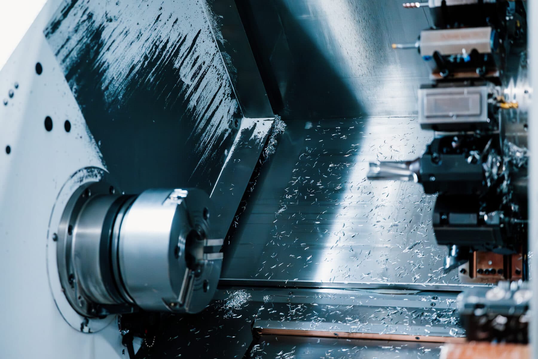 Inside a CNC turning centre: the chuck and turret with fresh chips