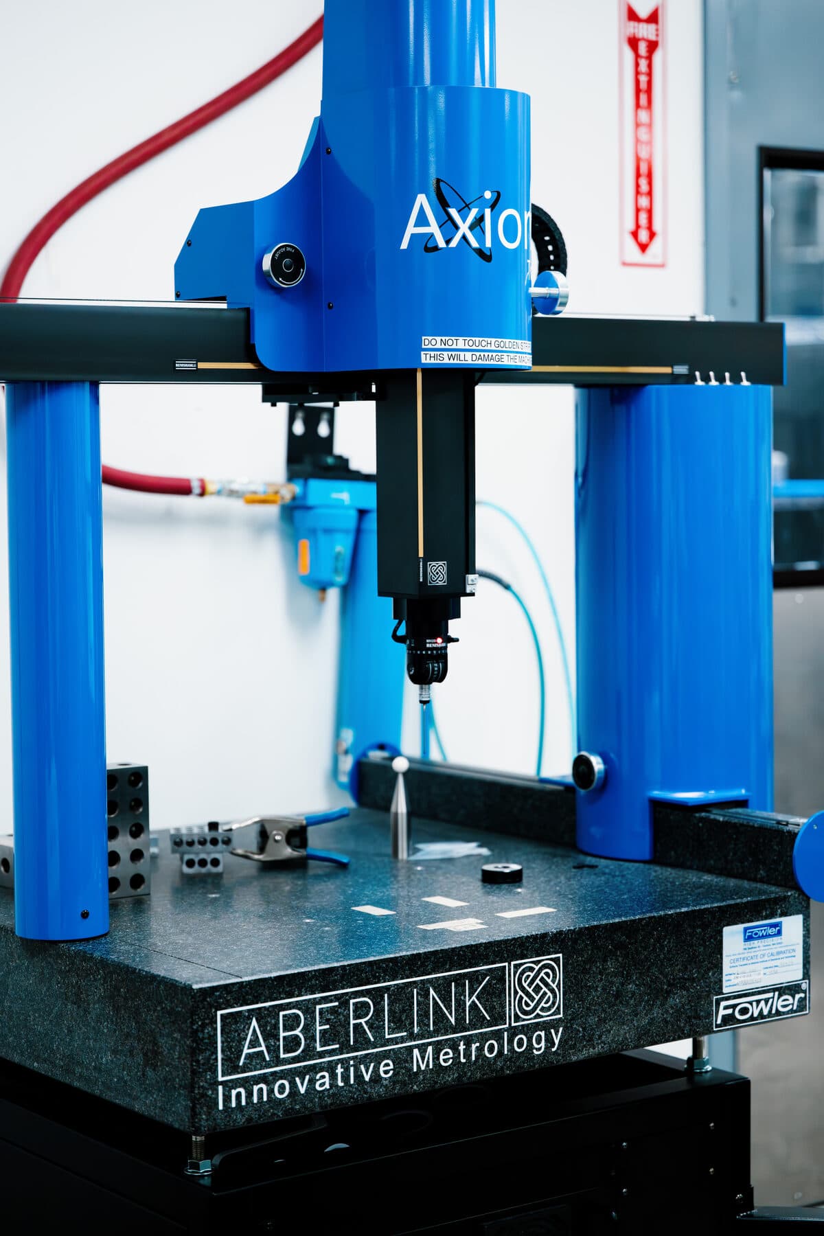 An Aberlink Axiom coordinate measuring machine over its granite table