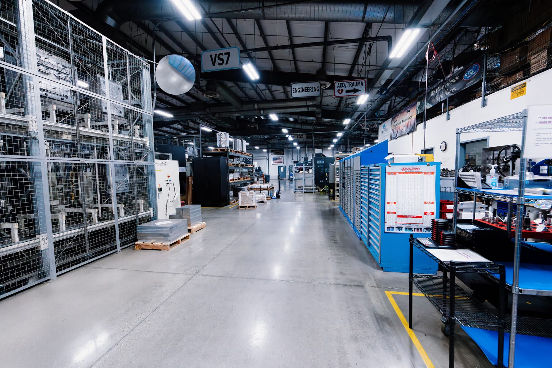An aisle of CNC machining cells on the production floor at JD Machine